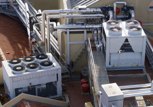 View of a huge group of air conditioning on a roof.